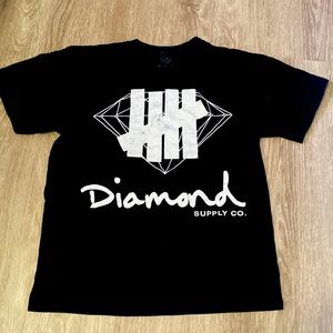 Black diamond supply Co. T-shirt with slightest bit of fading on tally marks.